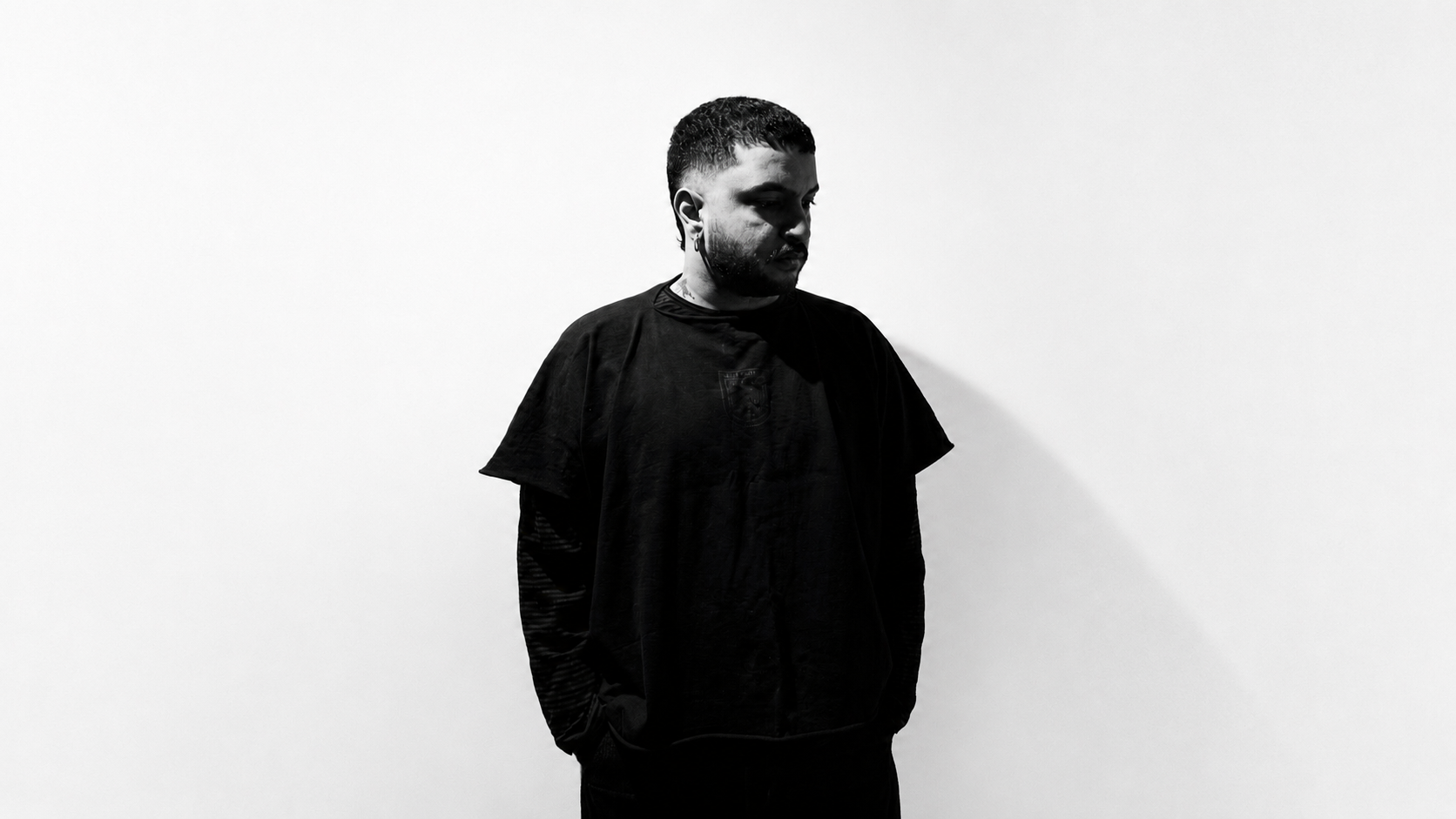 KIUZ in a black studio portrait